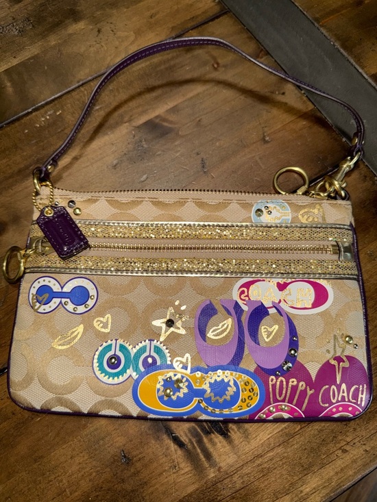 Coach Handbags - Coach Beige Signature Canvas Wristlet with Purple Accents